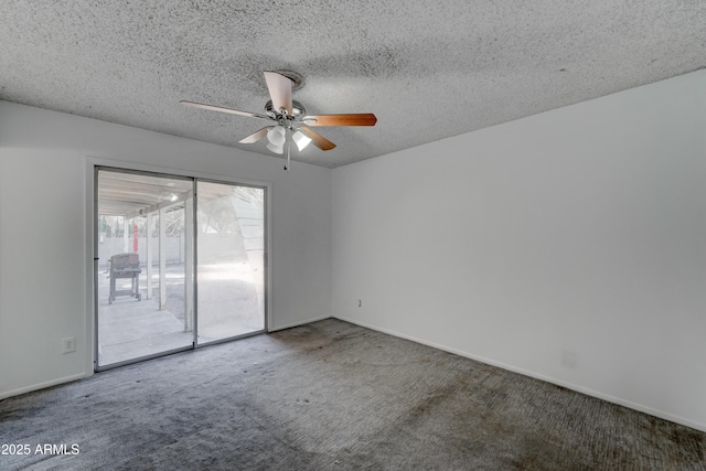 empty room featuring ceiling fan, carpet, and a textured ceiling