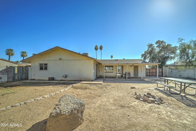 rear view of property featuring a patio