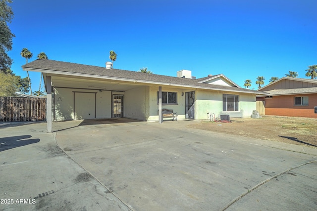 view of front of home featuring a carport