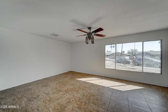 spare room featuring ceiling fan