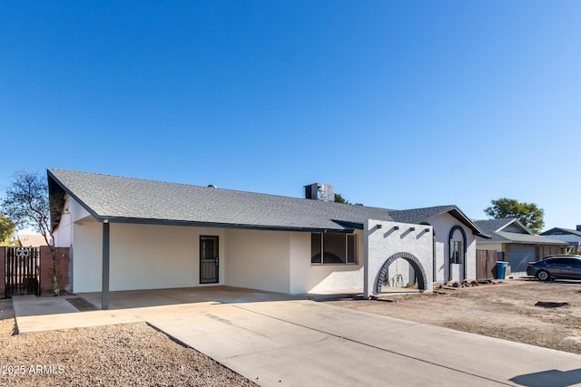 ranch-style home featuring a carport