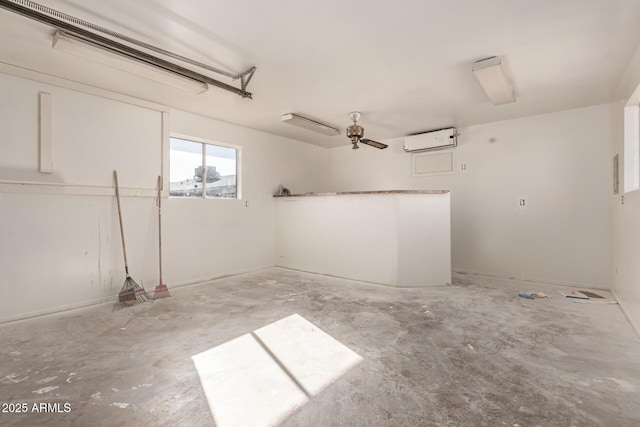 garage featuring a wall unit AC