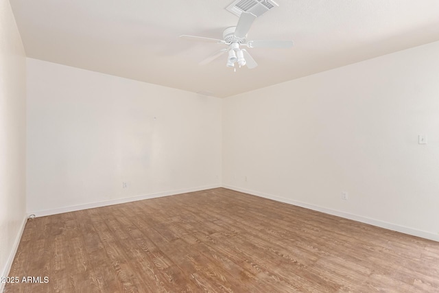 unfurnished room featuring light wood-type flooring and ceiling fan