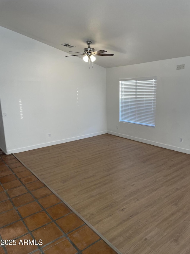 spare room with ceiling fan