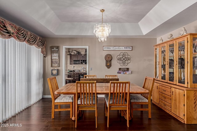 4648 W Misty Willow Ln, Glendale, AZ 85310 - dining room featuring a raised ceiling, a chandelier, and dark wood-type flooring