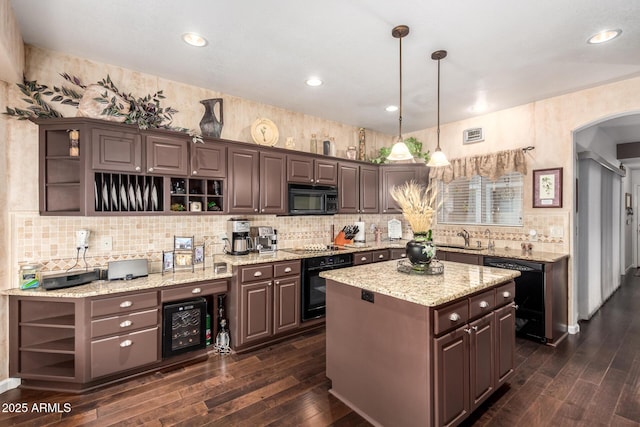 4648 W Misty Willow Ln, Glendale, AZ 85310 - kitchen featuring open shelves, black appliances, arched walkways, dark wood-style flooring, and recessed lighting