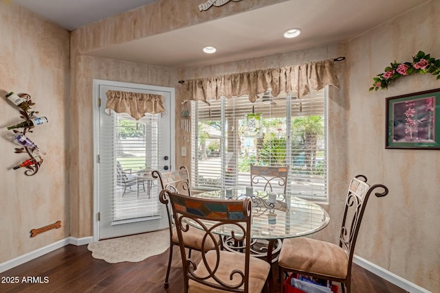 4648 W Misty Willow Ln, Glendale, AZ 85310 - dining space featuring dark wood finished floors and baseboards