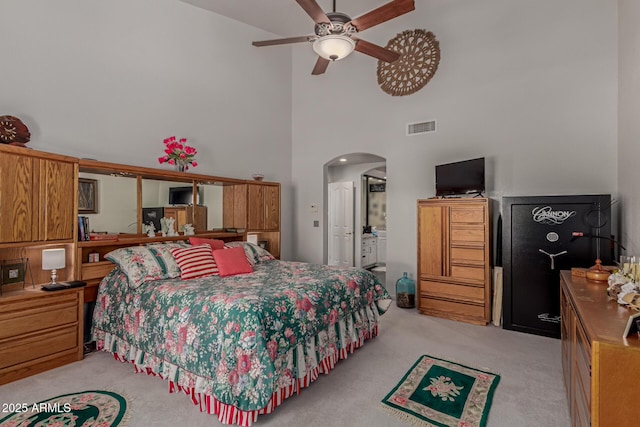 4648 W Misty Willow Ln, Glendale, AZ 85310 - bedroom with high vaulted ceiling, light colored carpet, arched walkways, and ceiling fan