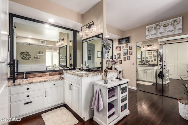 4648 W Misty Willow Ln, Glendale, AZ 85310 - bathroom featuring wood finished floors, vanity, and recessed lighting