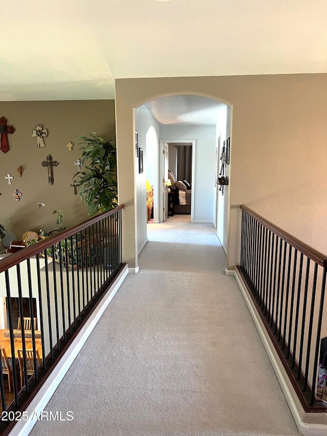 4648 W Misty Willow Ln, Glendale, AZ 85310 - corridor with arched walkways, carpet, and baseboards