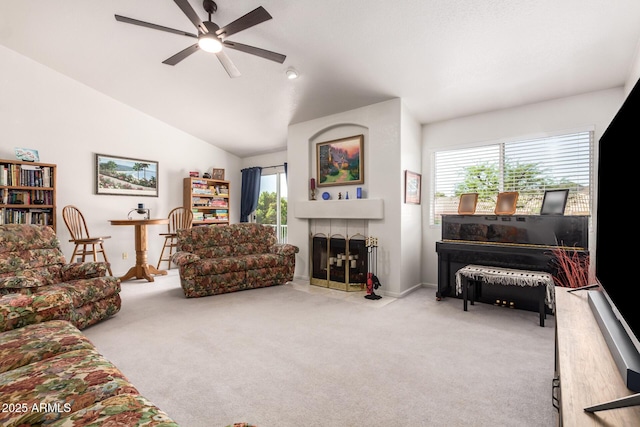 4648 W Misty Willow Ln, Glendale, AZ 85310 - carpeted living area with a ceiling fan, healthy amount of natural light, a tile fireplace, baseboards, and vaulted ceiling