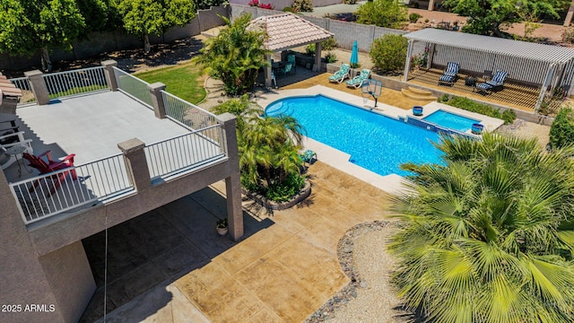 4648 W Misty Willow Ln, Glendale, AZ 85310 - view of pool featuring a gazebo, a patio, a pool with connected hot tub, and fence