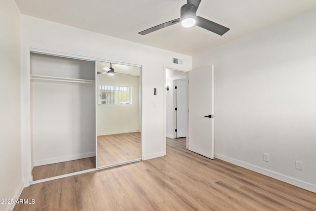 unfurnished bedroom with a closet, ceiling fan, and light hardwood / wood-style flooring