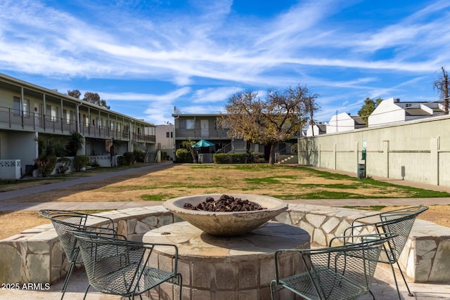 view of patio / terrace with an outdoor fire pit