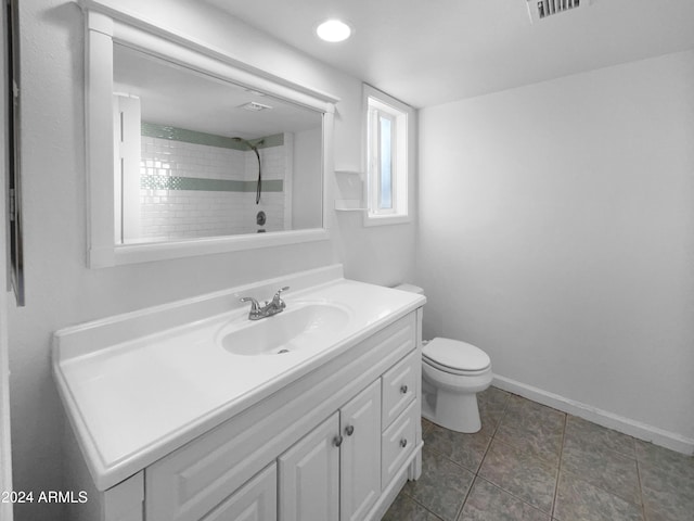 bathroom with tile patterned floors, vanity, and toilet