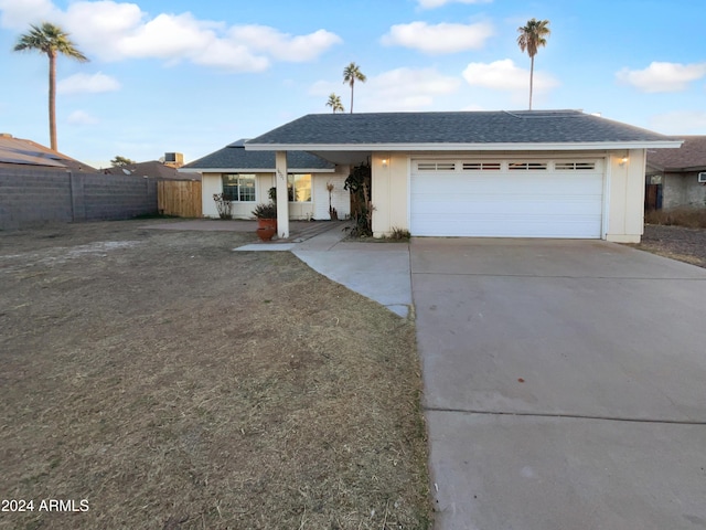 ranch-style home featuring a garage