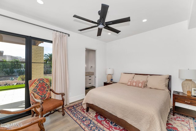 bedroom featuring wood-type flooring, connected bathroom, and ceiling fan