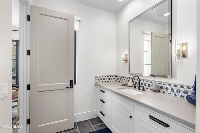 bathroom with tasteful backsplash and vanity