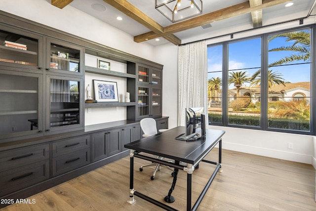 office featuring coffered ceiling, beam ceiling, and light hardwood / wood-style flooring