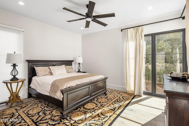 bedroom with hardwood / wood-style floors and ceiling fan