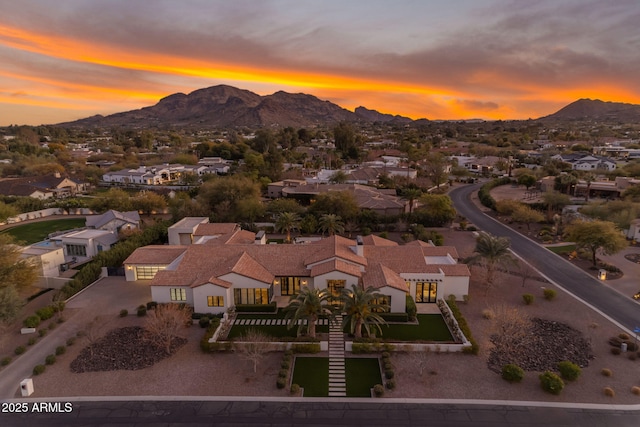 aerial view at dusk with a mountain view