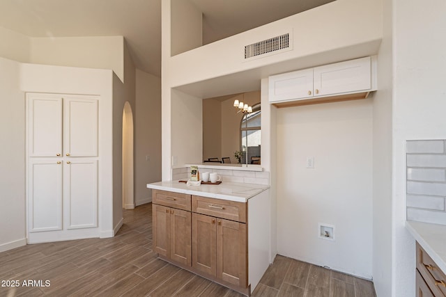 bathroom with vanity and an inviting chandelier