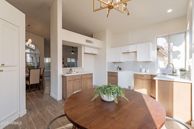 dining room featuring an inviting chandelier and sink