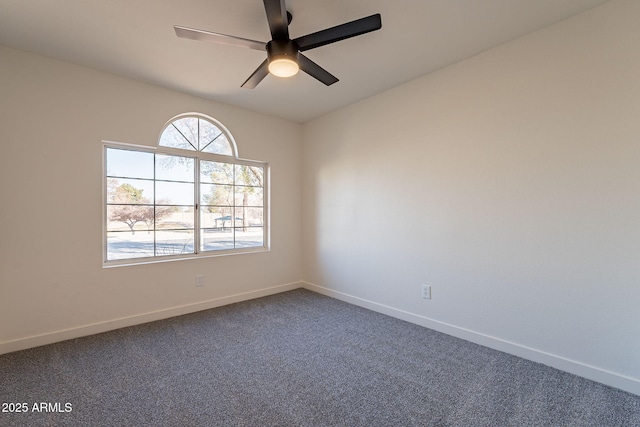 empty room with carpet flooring and ceiling fan