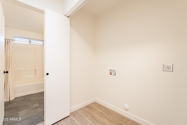 laundry room with hookup for a washing machine and hardwood / wood-style floors