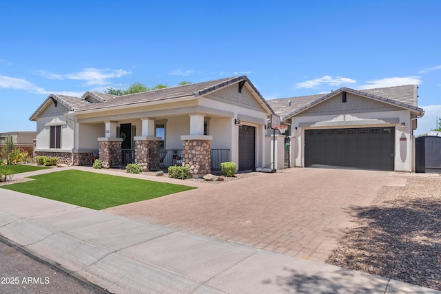 1500 E Sagittarius Pl, Chandler, AZ 85249 - view of front of house with a porch, a garage, decorative driveway, and stucco siding