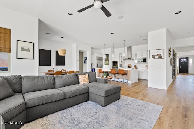 1500 E Sagittarius Pl, Chandler, AZ 85249 - living room featuring ceiling fan, light wood-style floors, and recessed lighting