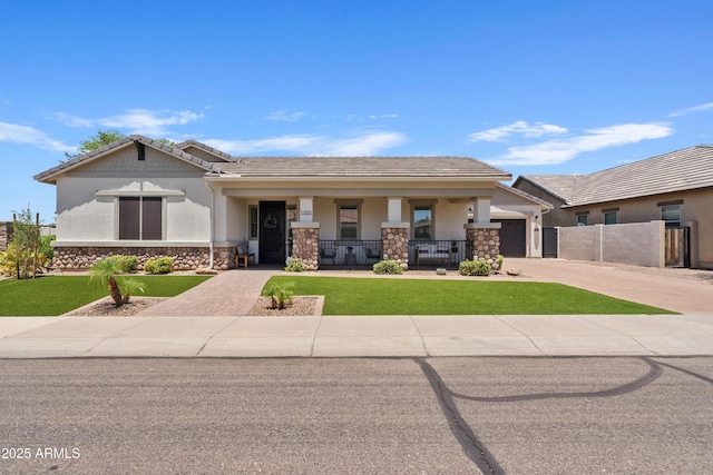 1500 E Sagittarius Pl, Chandler, AZ 85249 - view of front facade with concrete driveway, a porch, an attached garage, stone siding, and stucco siding