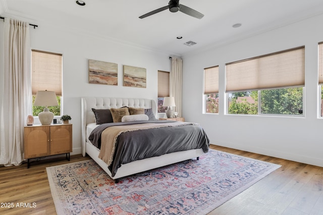 1500 E Sagittarius Pl, Chandler, AZ 85249 - bedroom featuring multiple windows, ornamental molding, light wood-type flooring, baseboards, and recessed lighting