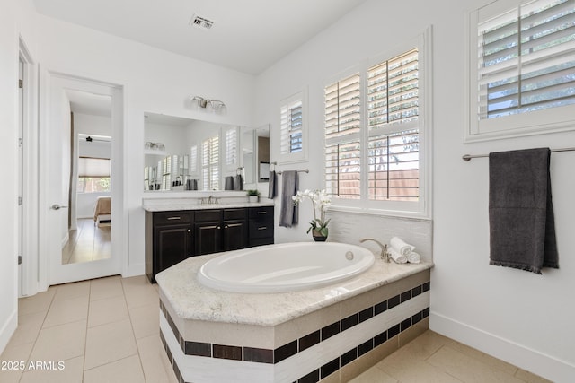 1500 E Sagittarius Pl, Chandler, AZ 85249 - full bath featuring plenty of natural light, a garden tub, vanity, and baseboards