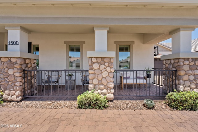 1500 E Sagittarius Pl, Chandler, AZ 85249 - doorway to property with a porch and stucco siding