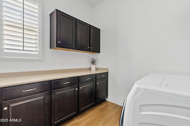 1500 E Sagittarius Pl, Chandler, AZ 85249 - laundry area featuring separate washer and dryer, cabinet space, and light wood-style floors