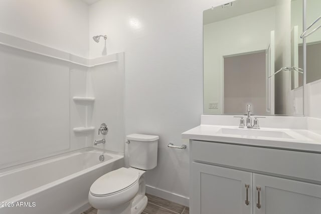 full bathroom with toilet, baseboards, vanity, wood finished floors, and bathing tub / shower combination