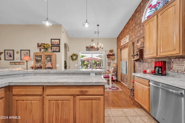 kitchen with dishwasher, tasteful backsplash, a notable chandelier, pendant lighting, and light tile patterned floors