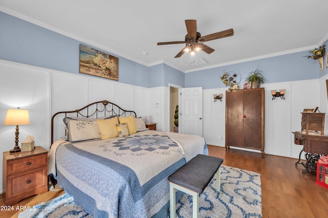 bedroom with ceiling fan, hardwood / wood-style flooring, and ornamental molding