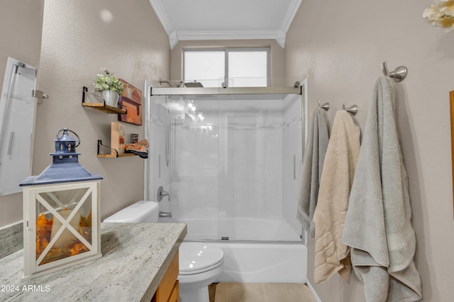 full bathroom with vanity, toilet, ornamental molding, and enclosed tub / shower combo