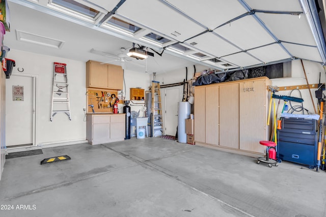 garage featuring a garage door opener and gas water heater