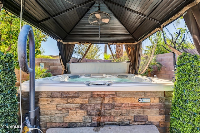 view of patio featuring a gazebo and a hot tub