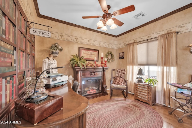 living area with ceiling fan, ornamental molding, and hardwood / wood-style flooring