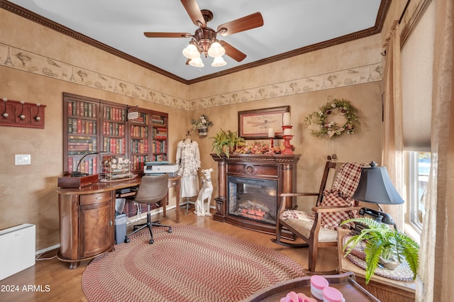 office space featuring wood-type flooring, ceiling fan, and crown molding