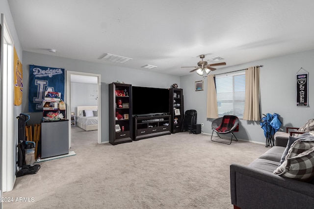 living room featuring ceiling fan and light colored carpet