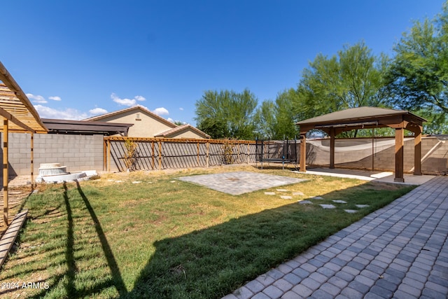 view of yard featuring a gazebo and a patio area