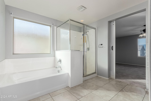 bathroom featuring tile patterned flooring, ceiling fan, and independent shower and bath