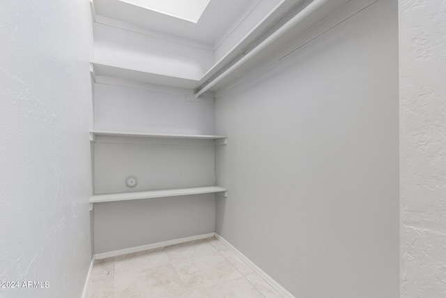 walk in closet with a skylight