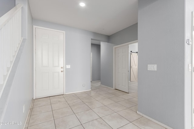 entrance foyer featuring light tile patterned floors