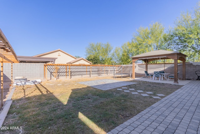 view of yard with a gazebo, a patio, and a trampoline